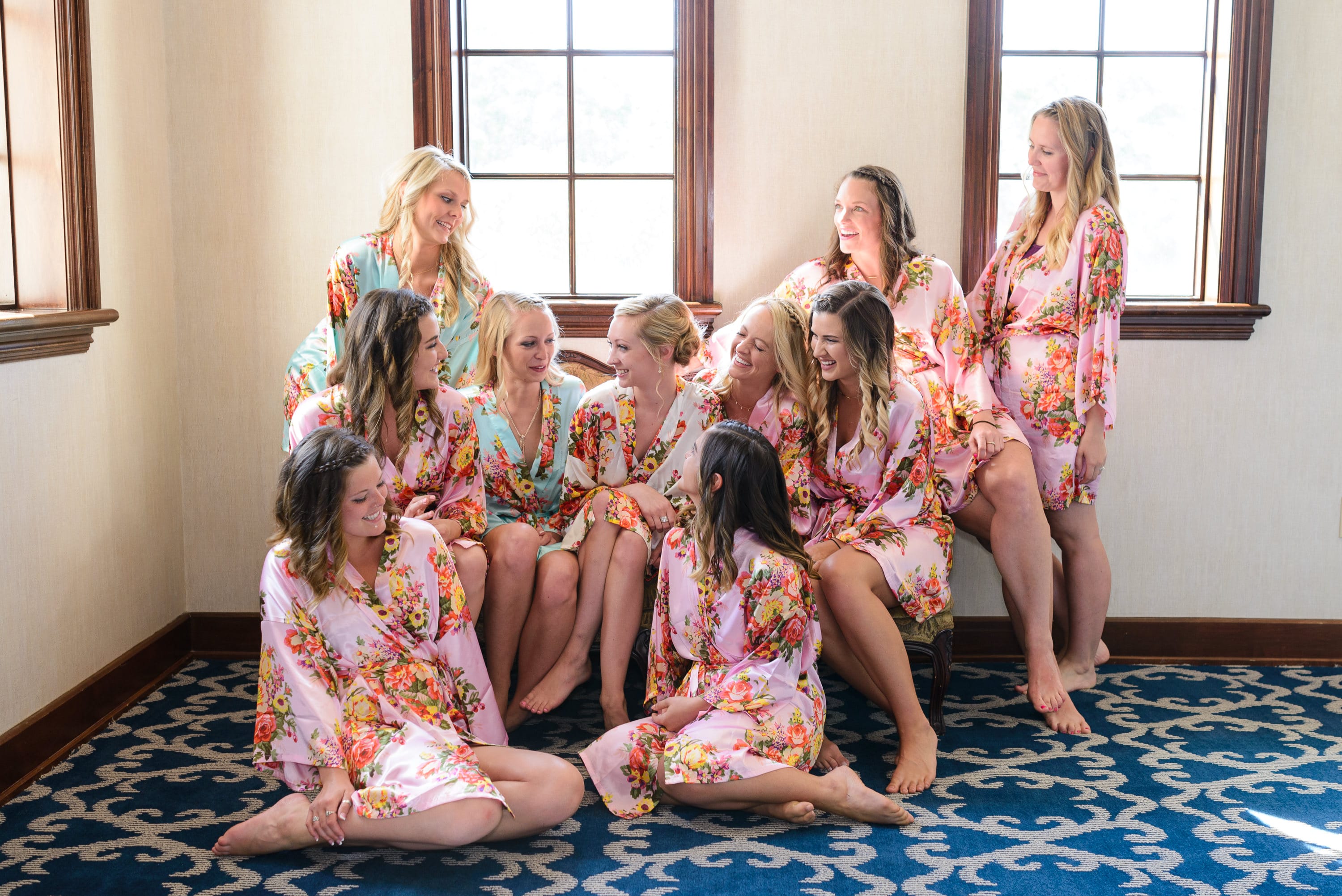 Bridesmaids sitting on couch with bride -  Grande Dunes Ocean Club