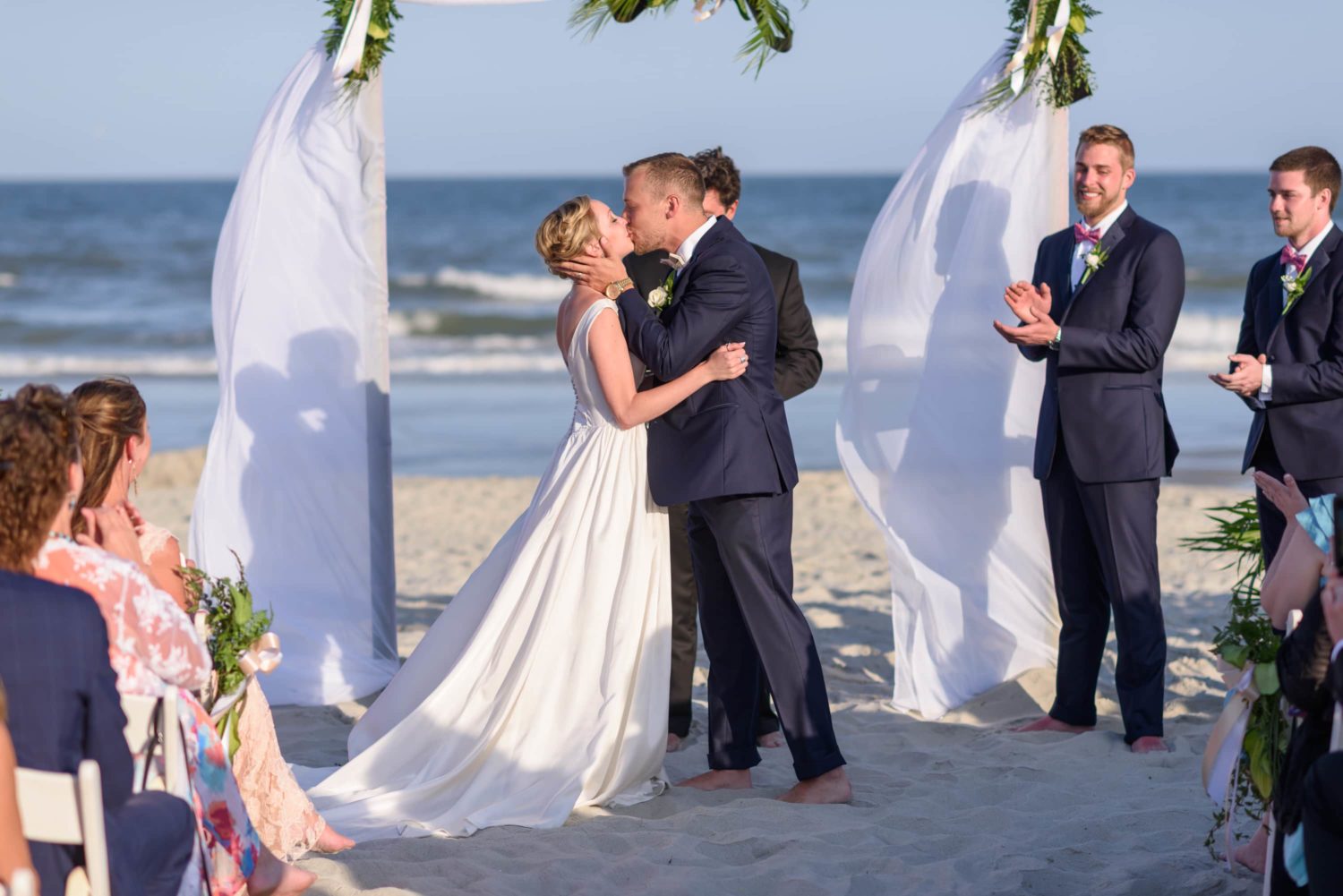 First kiss during beach wedding ceremony -  Grande Dunes Ocean Club