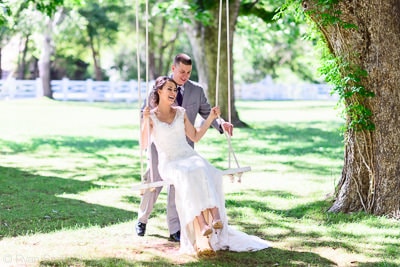 Groom pushing bride on a swing -  Wildberry Farm