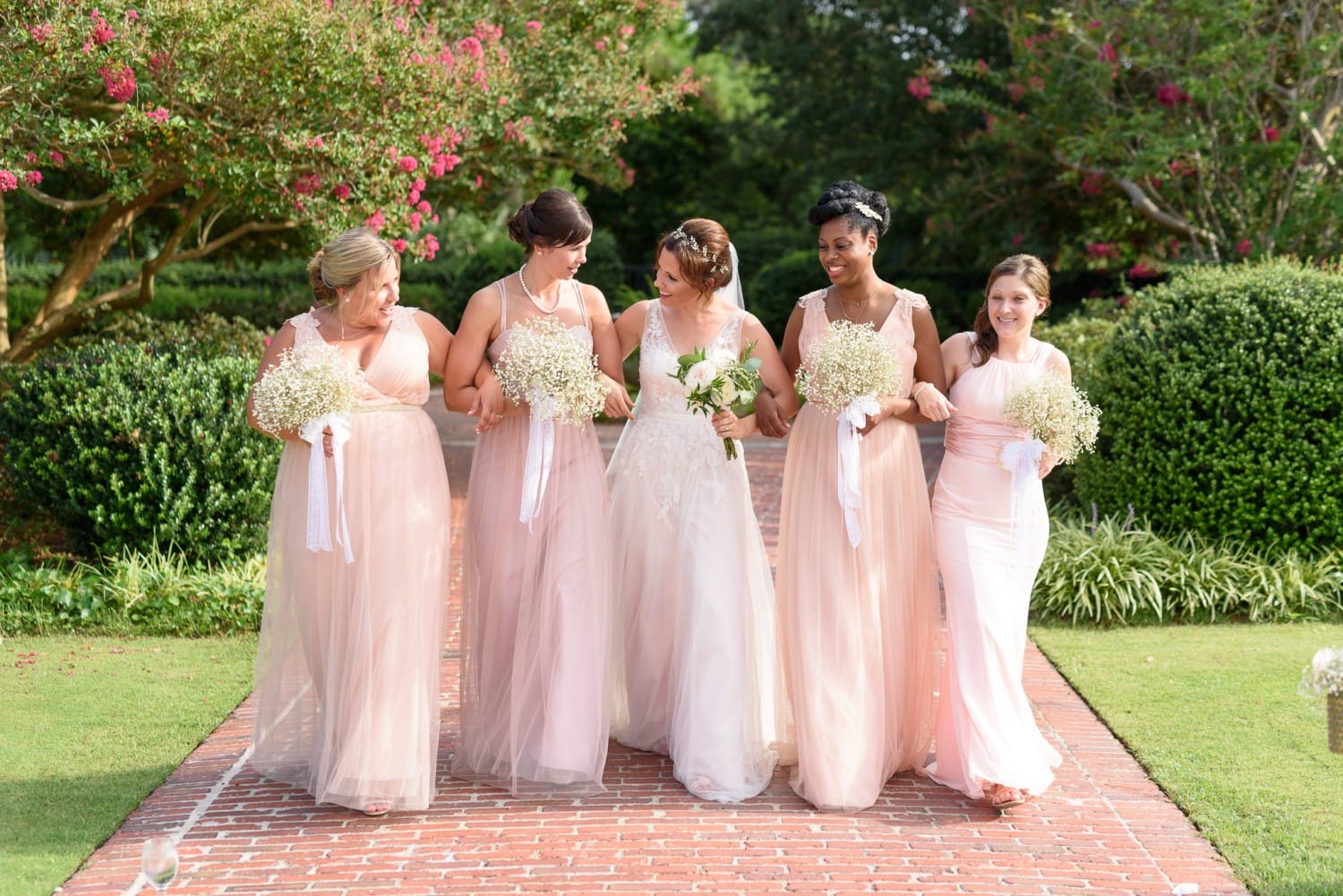 Bride and bridesmaids walking together Pine Lakes Country Club