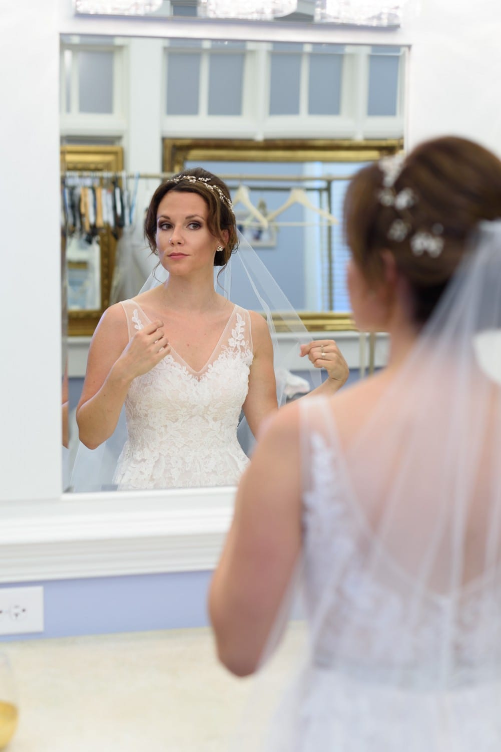 Bride checking herself out in the mirror Pine Lakes Country Club