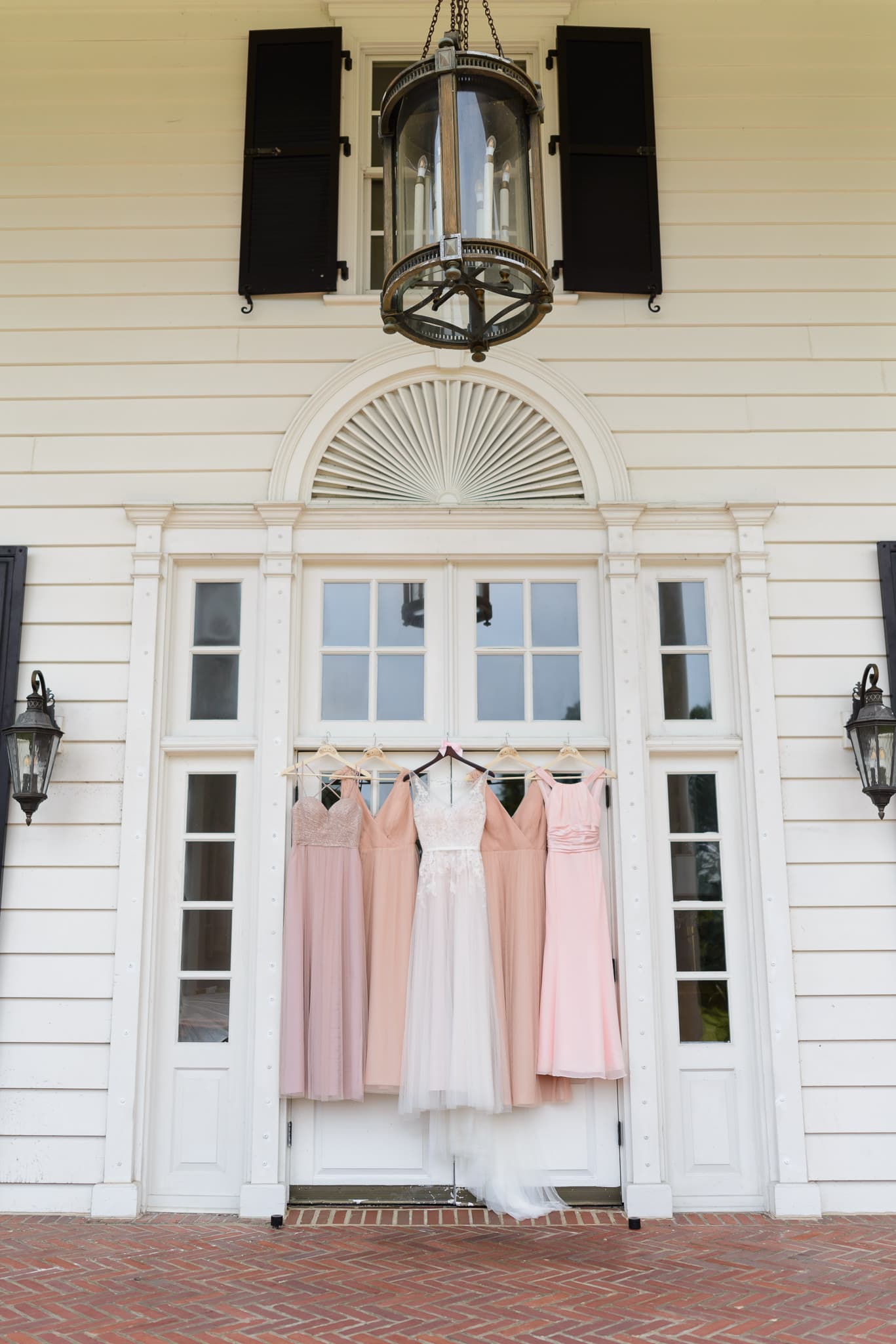Bridesmaid dress hanging on doorway Pine Lakes Country Club
