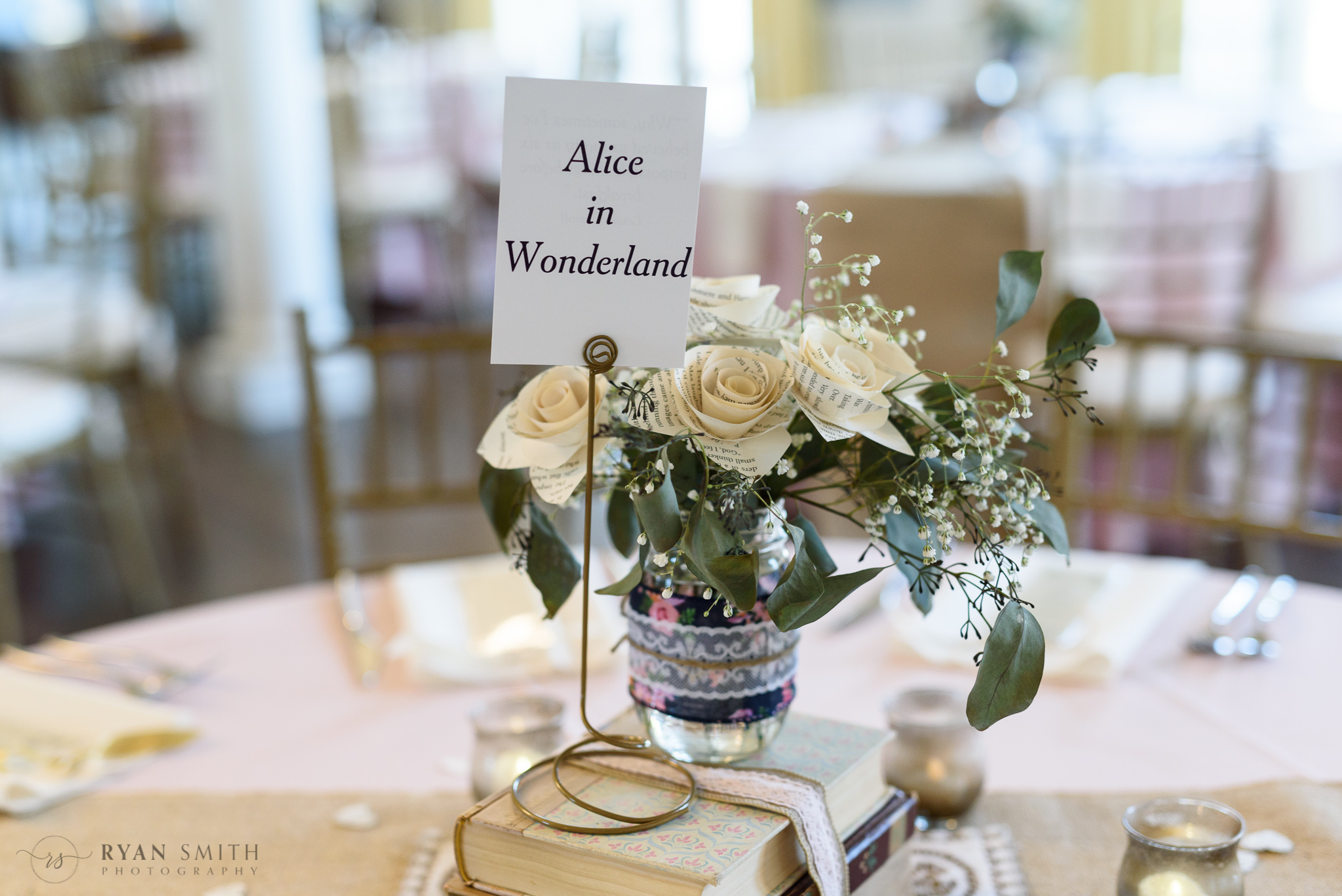 Table decorations with flowers made from book pages - Pine Lakes Country Club