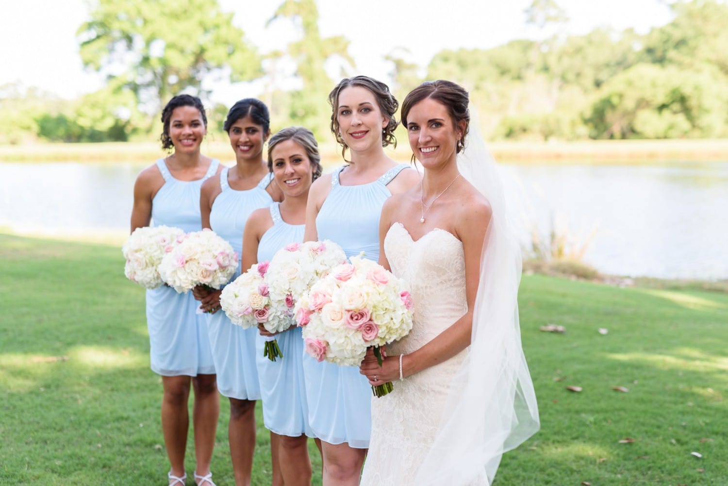 Bride in focus with bridesmaids behind - Pawleys Plantation