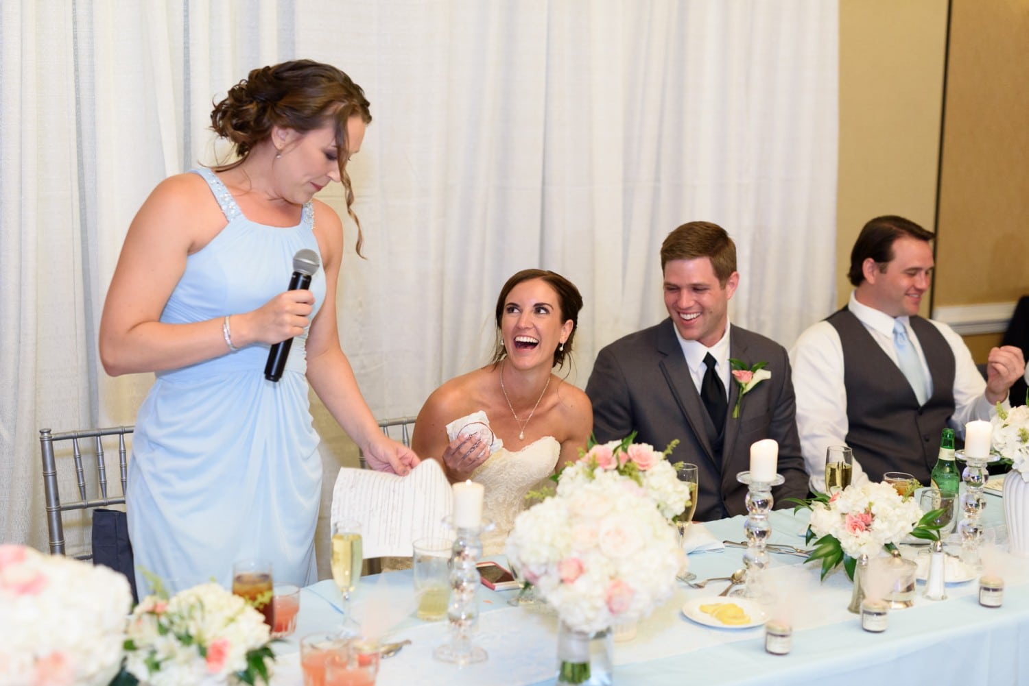 Bride laughing at toast from sister - Pawleys Plantation