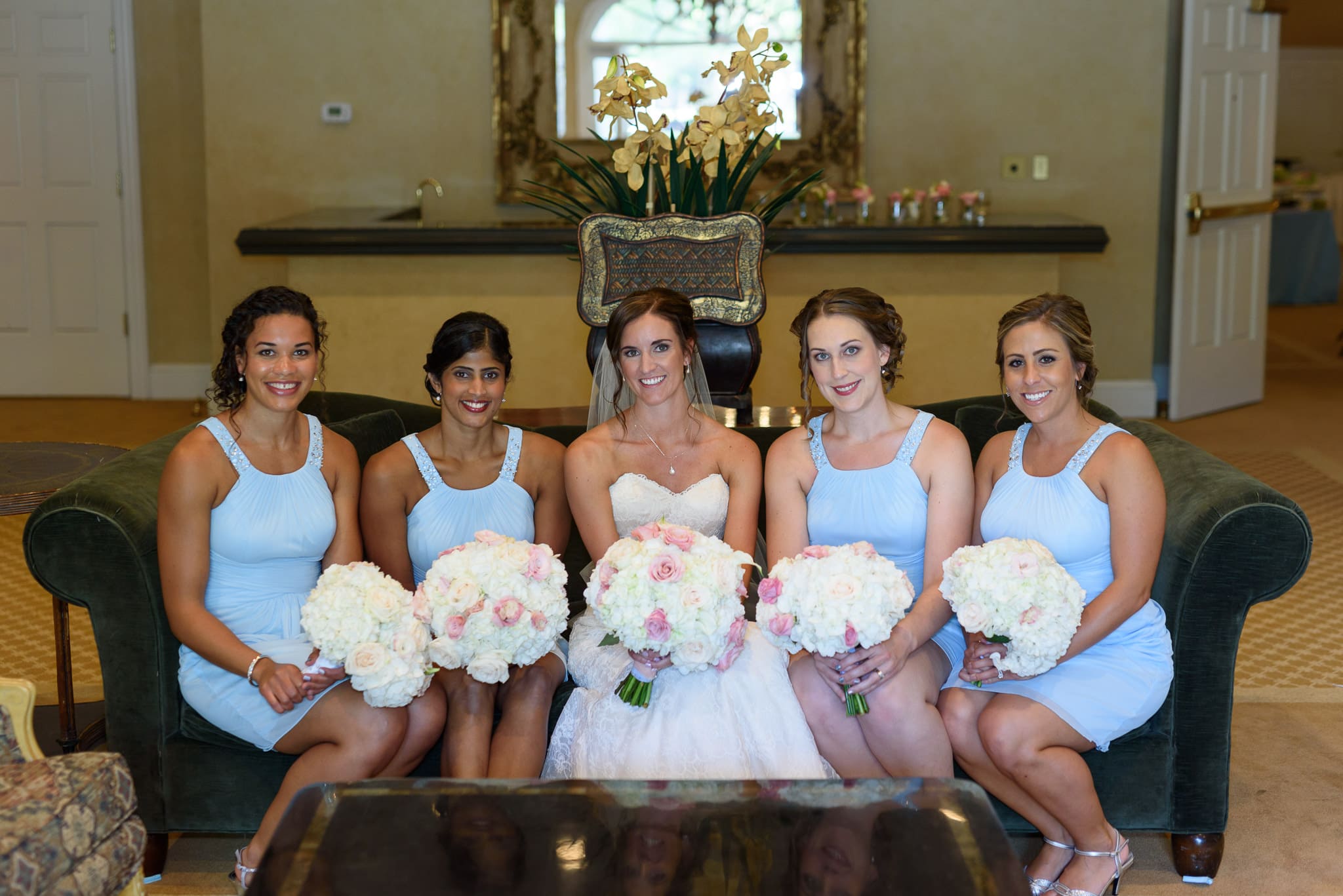 Bridesmaids sitting on couch together - Pawleys Plantation