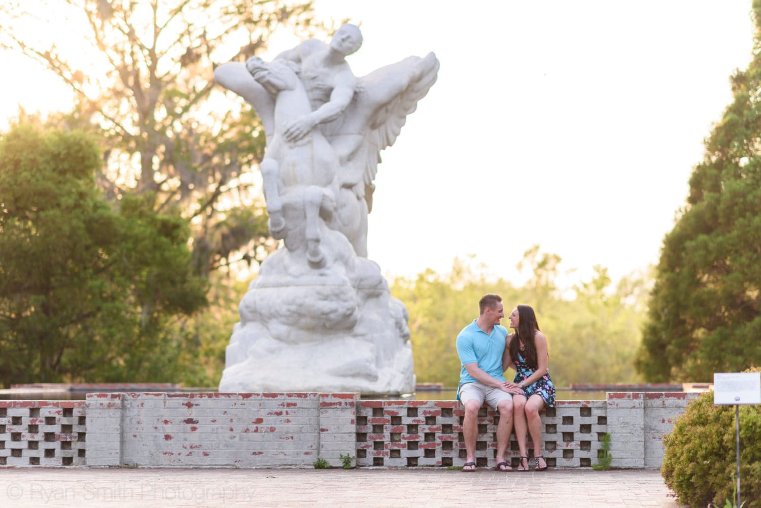 Couple sitting by the Pegasus statue - Brookgreen Gardens