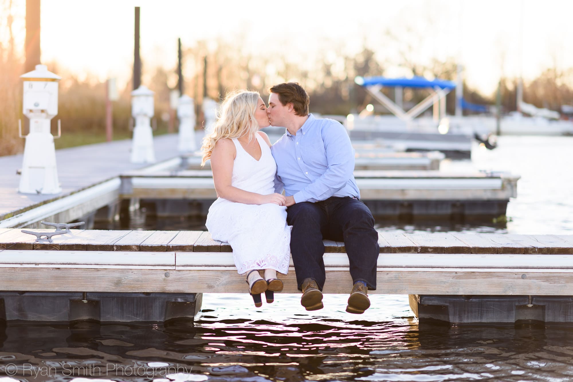 Couple sitting on dock together - Litchfield Plantation
