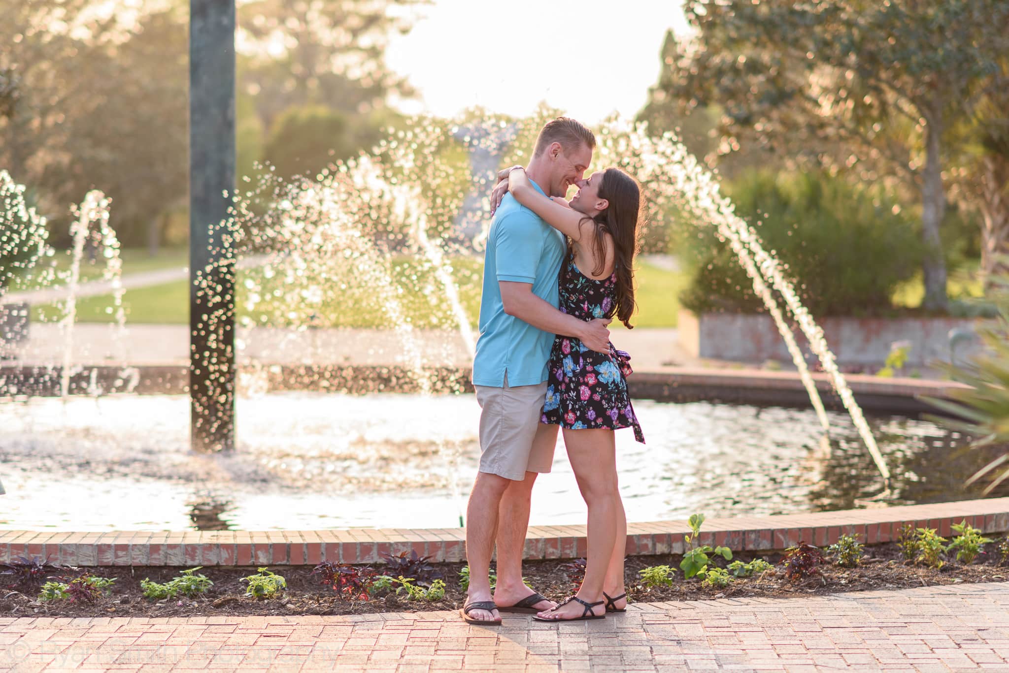 Couple smiling at each other in front of the fountain - Brookgreen Gardens