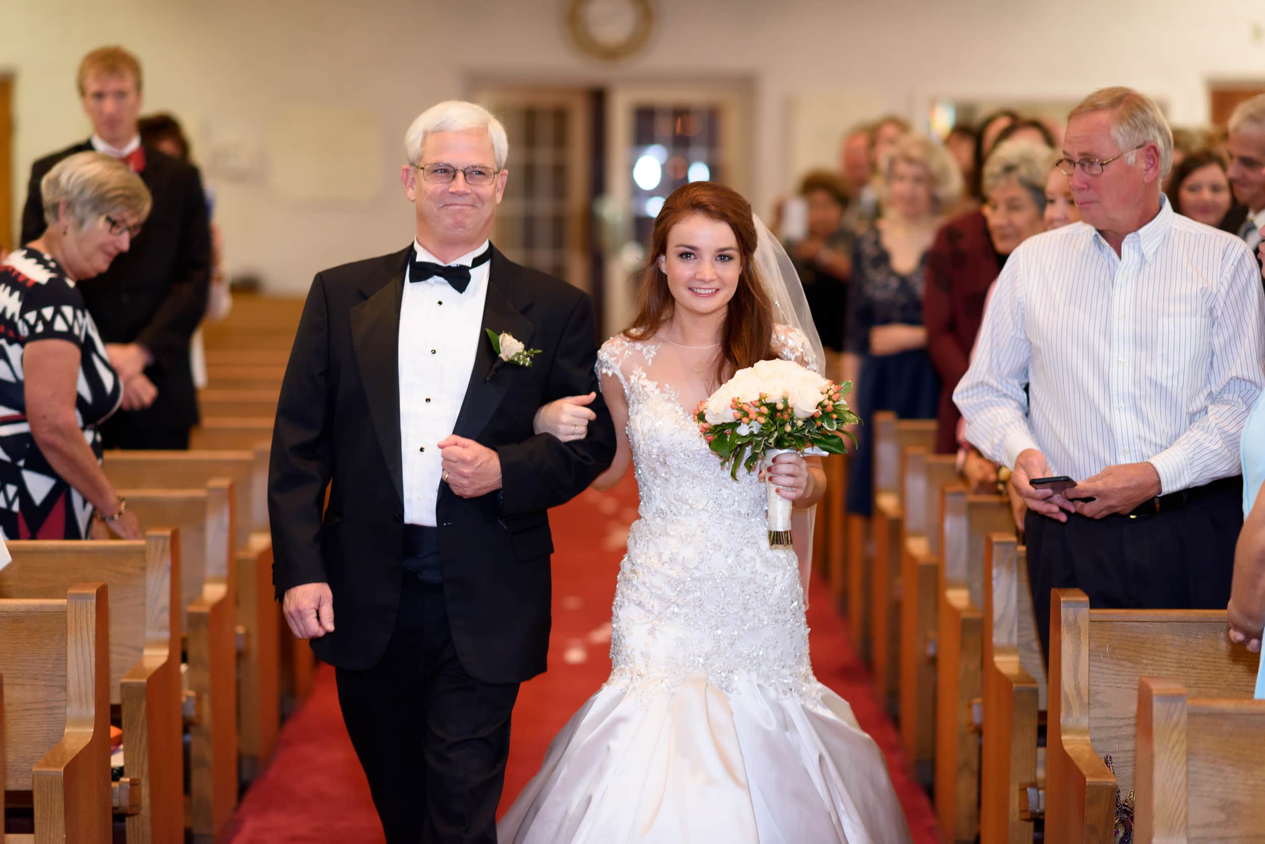 Emotional bride walking down isle with father - Historic Church downtown Georgetown