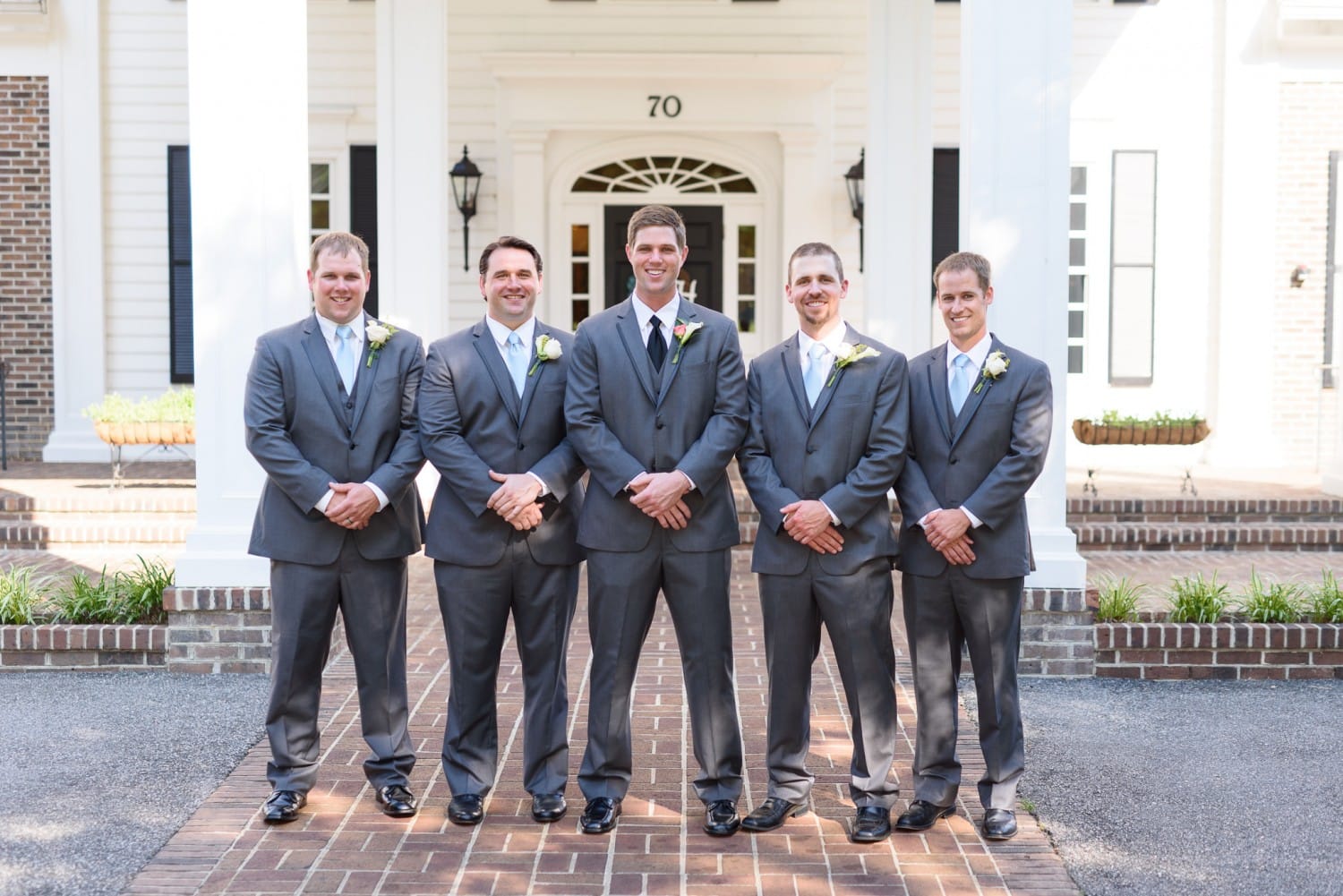 Groomsmen standing in front of the golf clubhouse - Pawleys Plantation