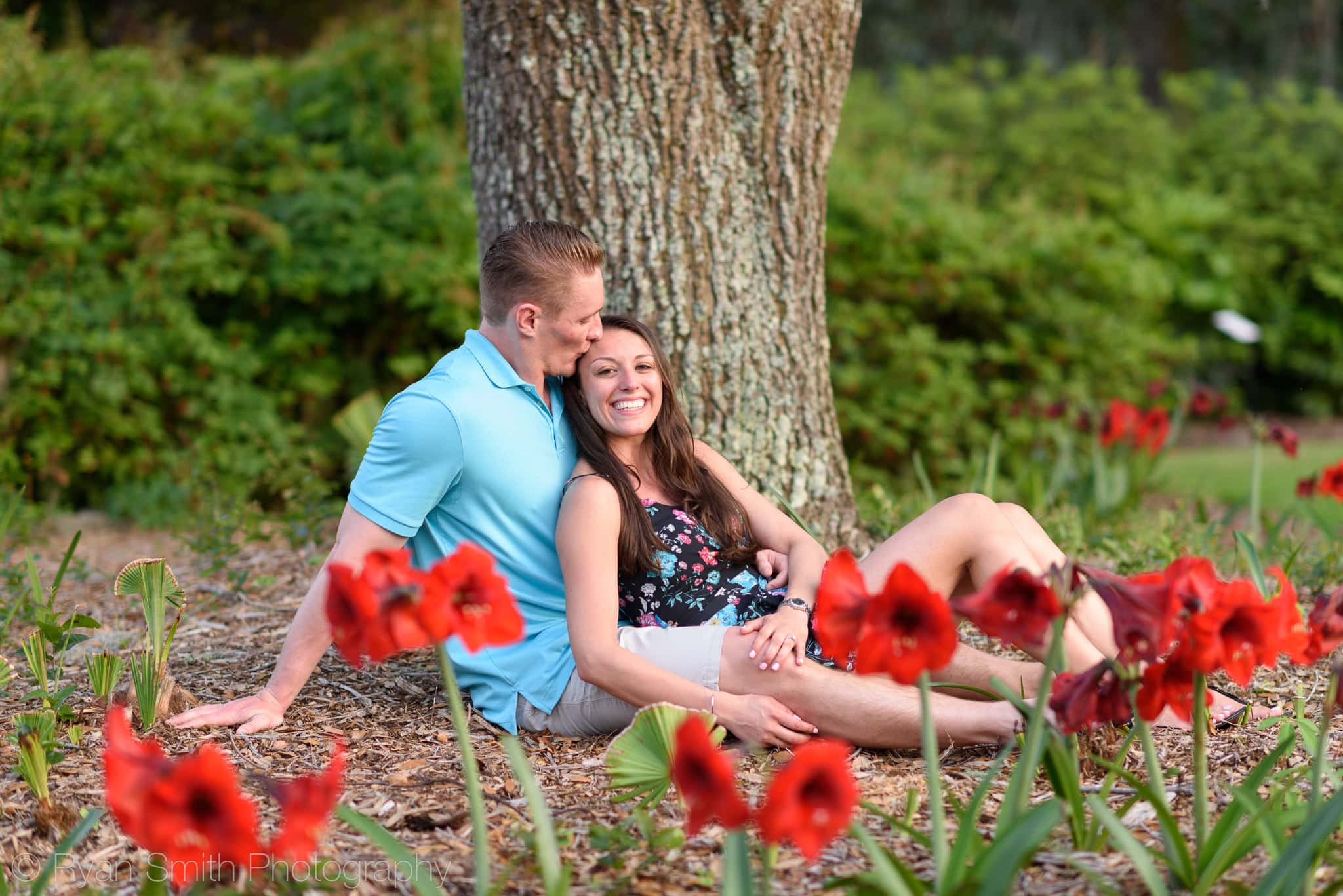 Kiss on the head behind the flowers - Brookgreen Gardens