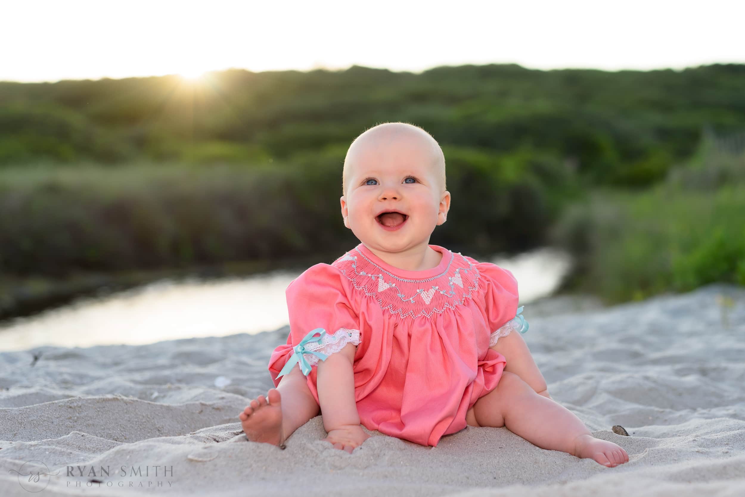 Smiling baby in the sunset - Myrtle Beach State Park