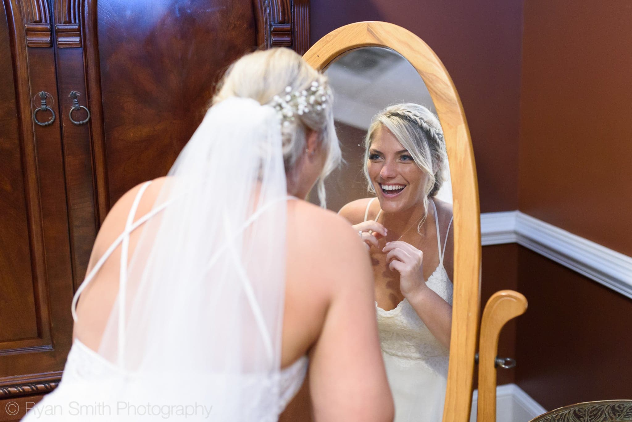 Bride looking in the mirror - Pawleys Plantation
