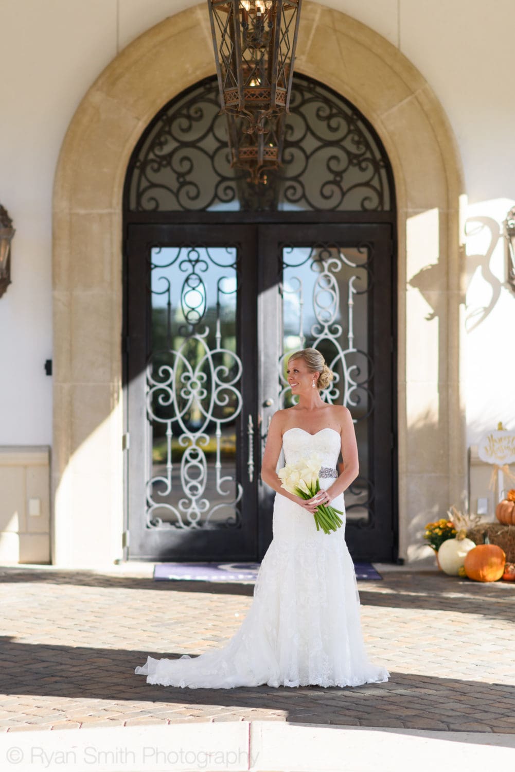 Bride standing in front of doors - Members Club - Grande Dunes