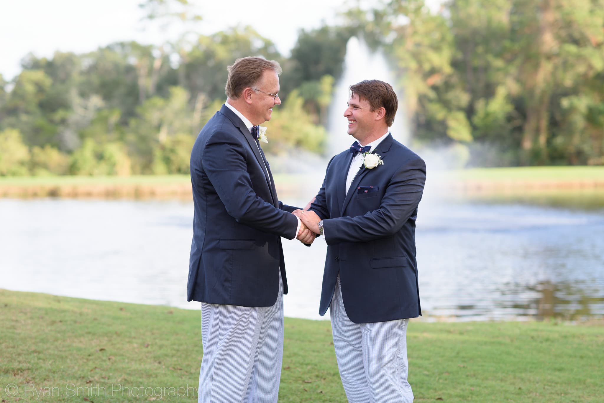 Bride's father shaking hands with groom - Pawleys Plantation