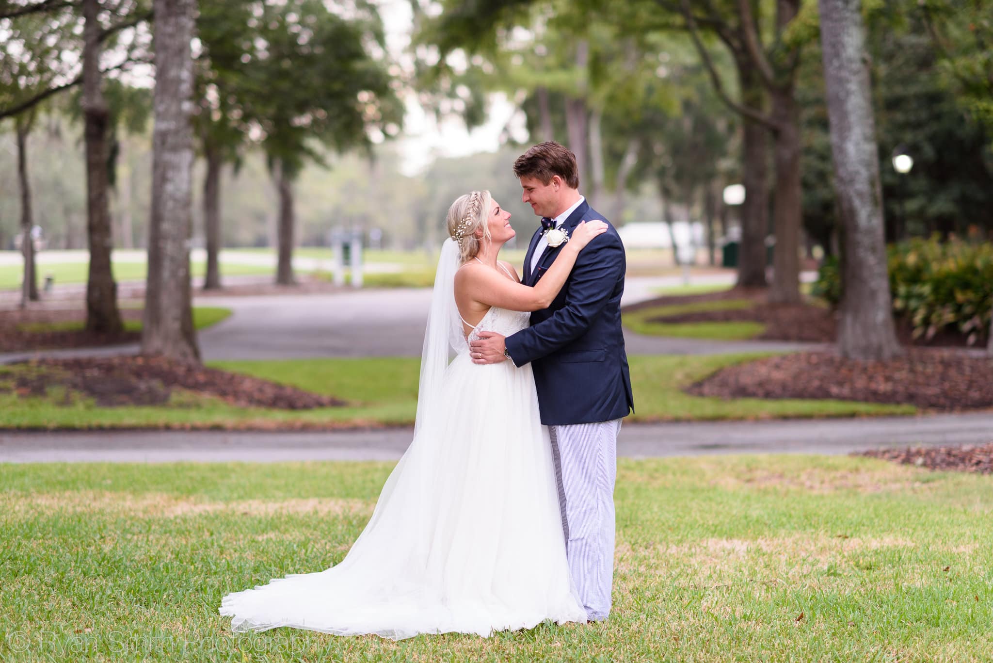 Couple together on the front lawn - Pawleys Plantation
