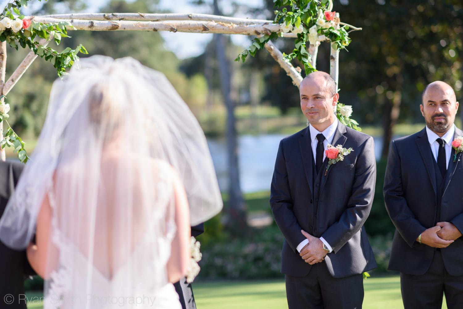 Groom's first look at bride during the ceremony - Pawleys Plantation
