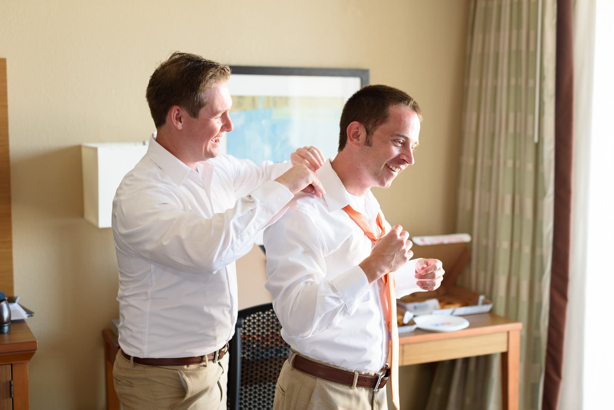 Best man helping groom with tie - Hilton at Kingston Plantation