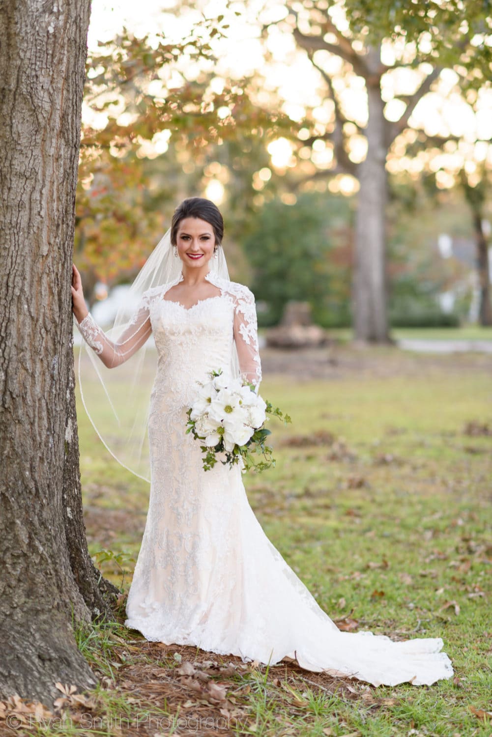 Bridal portraits backlit by sunlight coming through the trees - Rosewood Manor, Marion