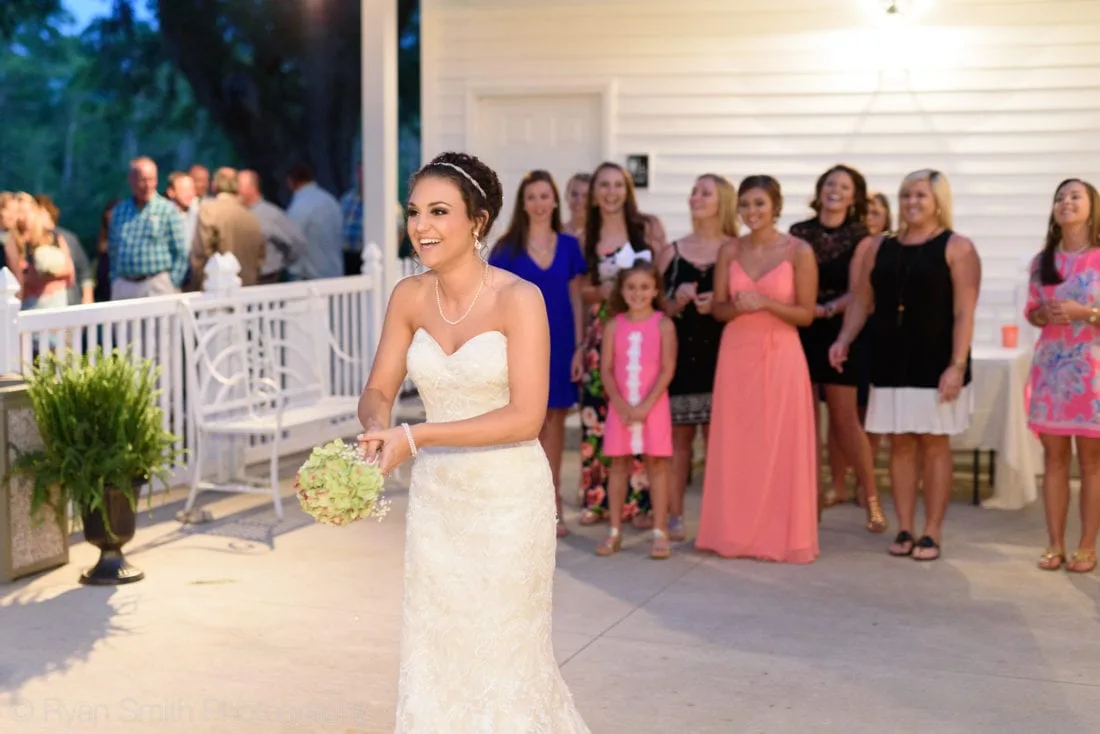 Bride about to throw her bouquet - Upper Mill Plantation