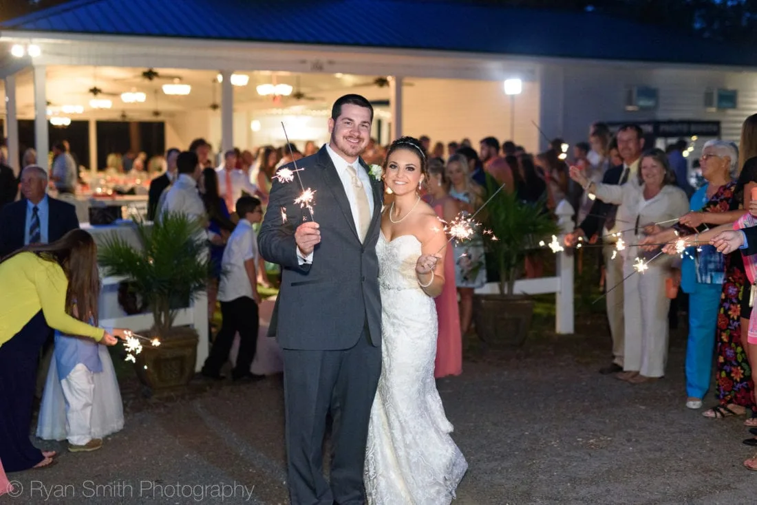 Bride and groom holding sparklers - Upper Mill Plantation