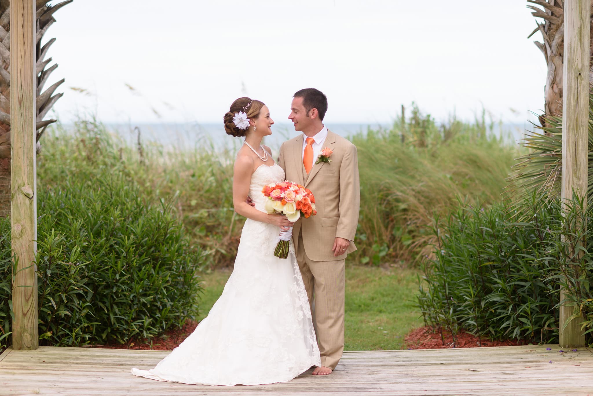 Bride and groom smiling at each other - Hilton at Kingston Plantation