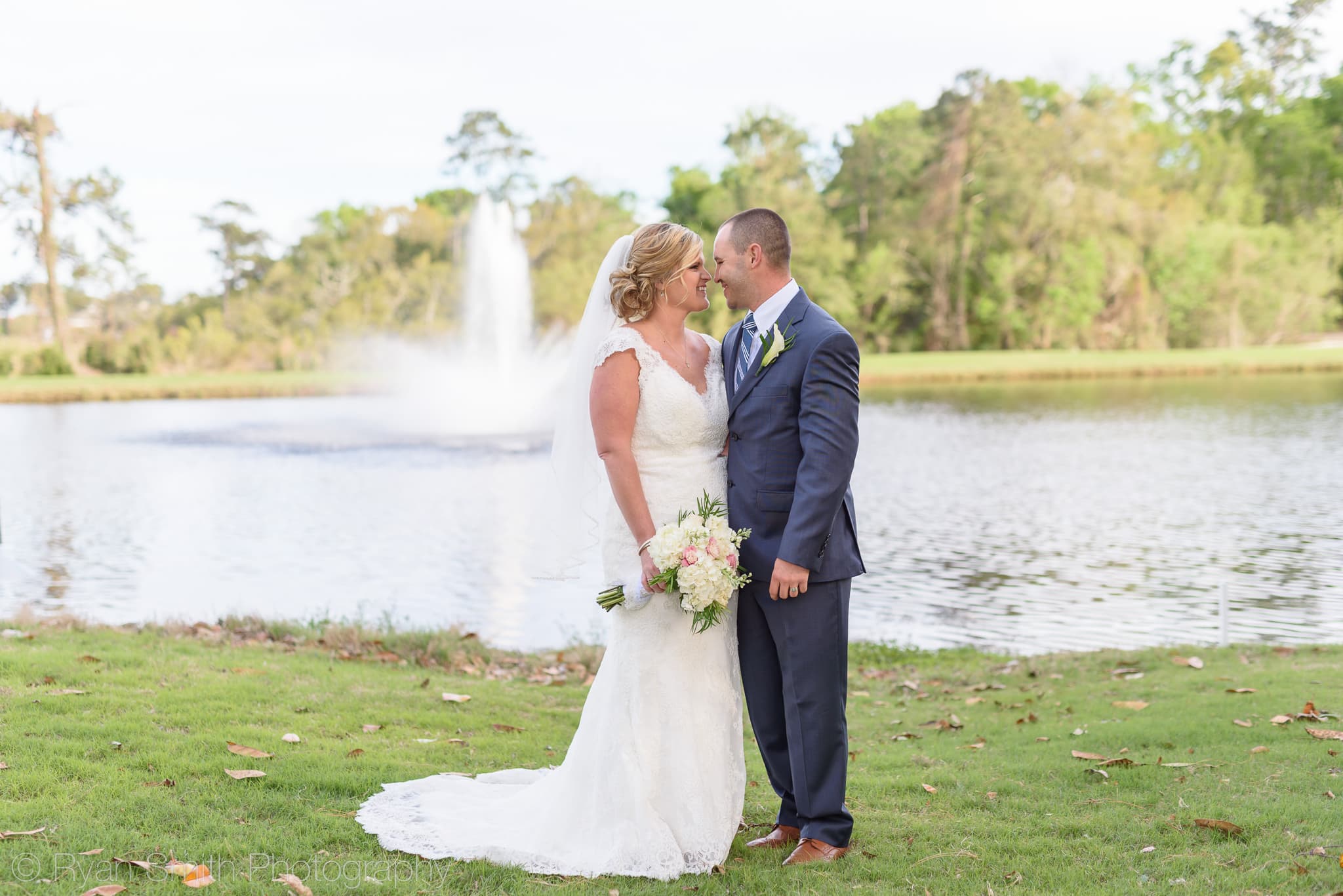 Bride and groom smiling at each other - Pawleys Plantation