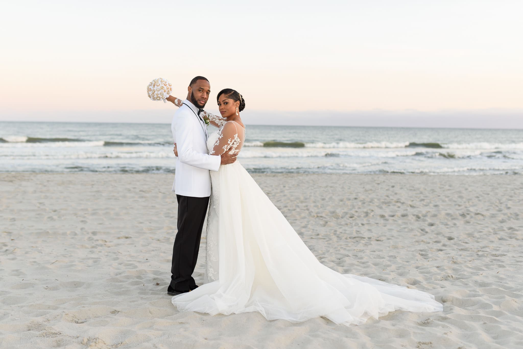 Bride and groom standing in front of ocean - Doubletree Resort by Hilton Myrtle Beach
