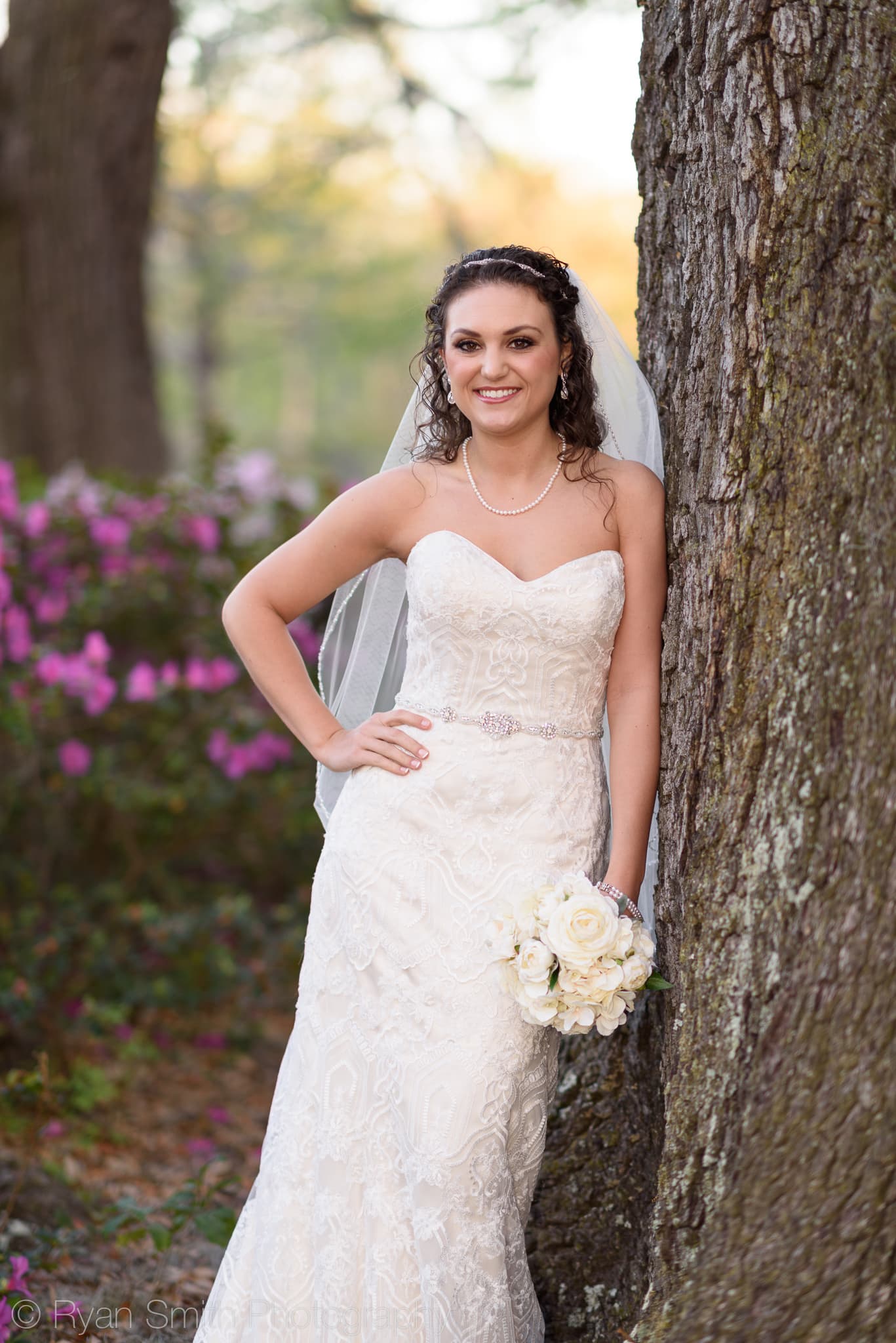 Bride leaning against a tree - Upper Mill Plantation