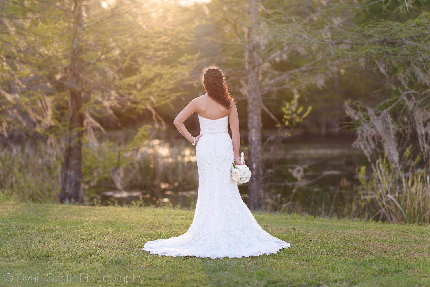 Bride looking out at the sunset - Upper Mill Plantation