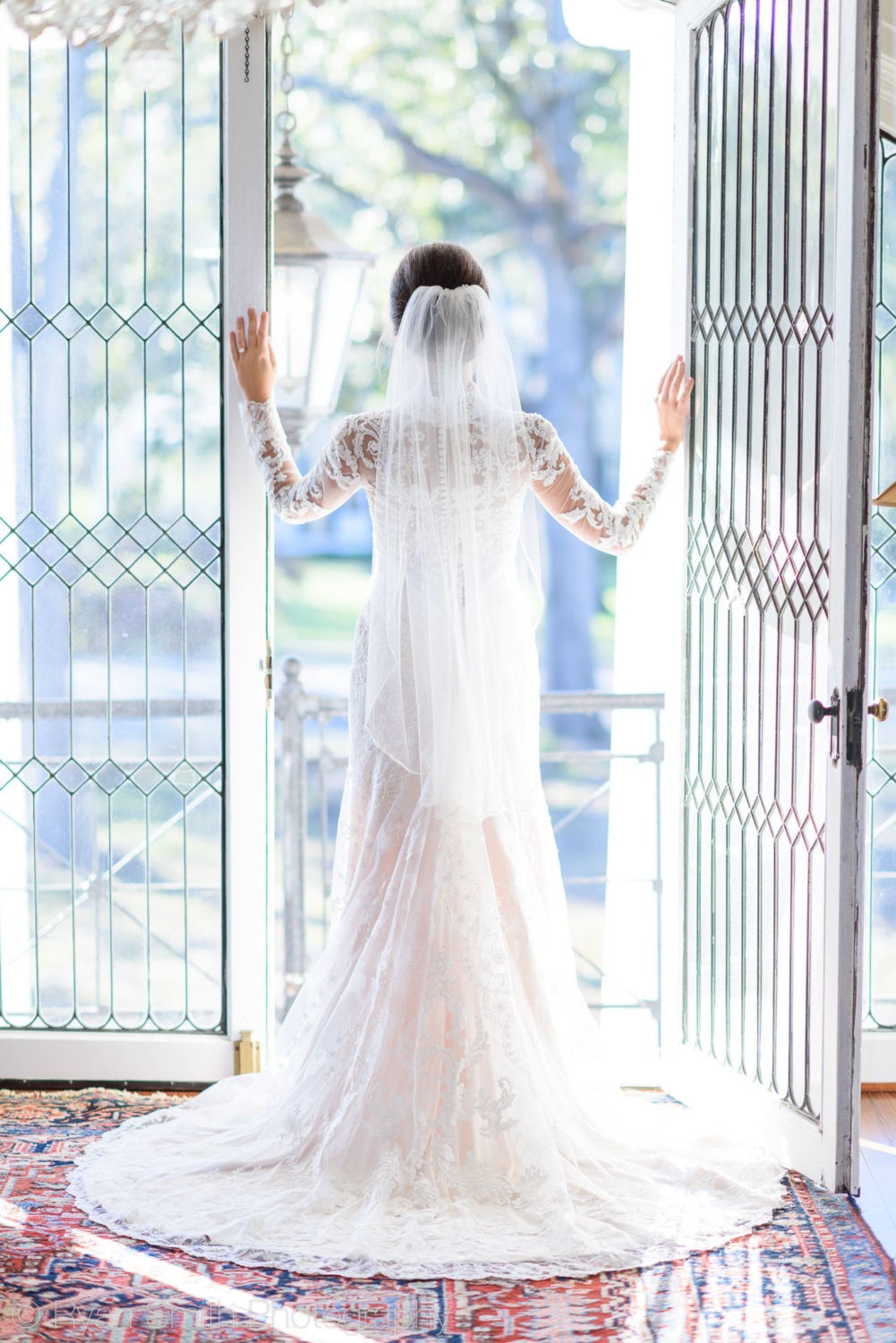 Bride looking out of doorway - Rosewood Manor, Marion