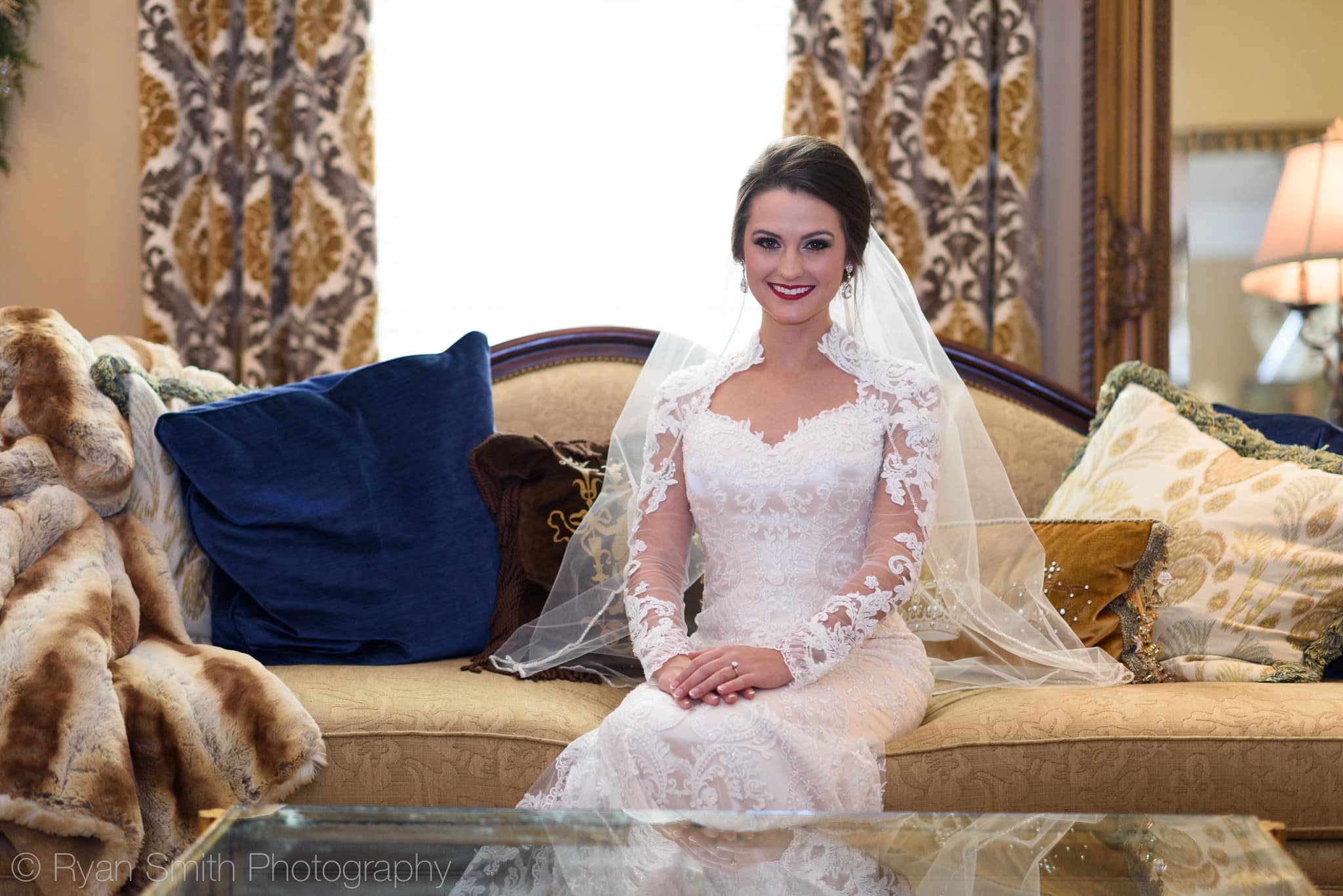 Bride sitting on couch by window - Rosewood Manor, Marion