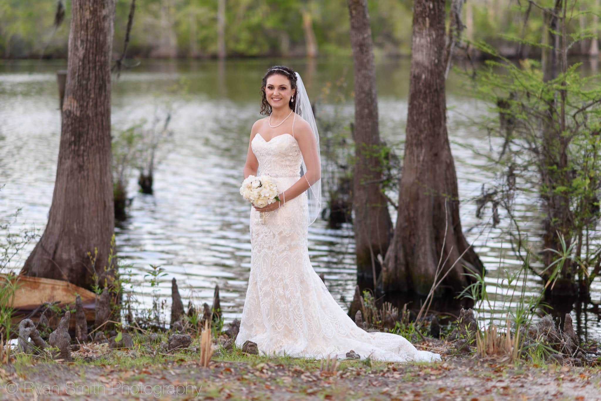 Bride standing by the river - Upper Mill Plantation