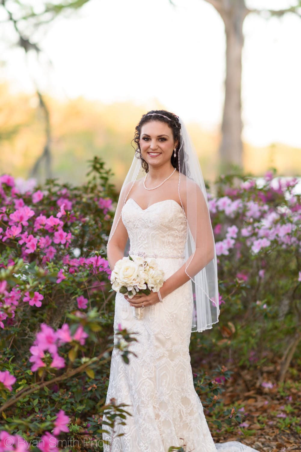 Bride surrounded by flowers - Upper Mill Plantation