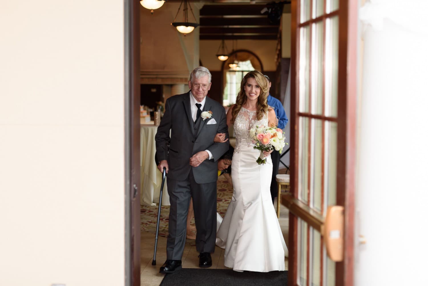 Bride with grandfather walking out of doorway - Grande Dunes Ocean Club - Myrtle Beach