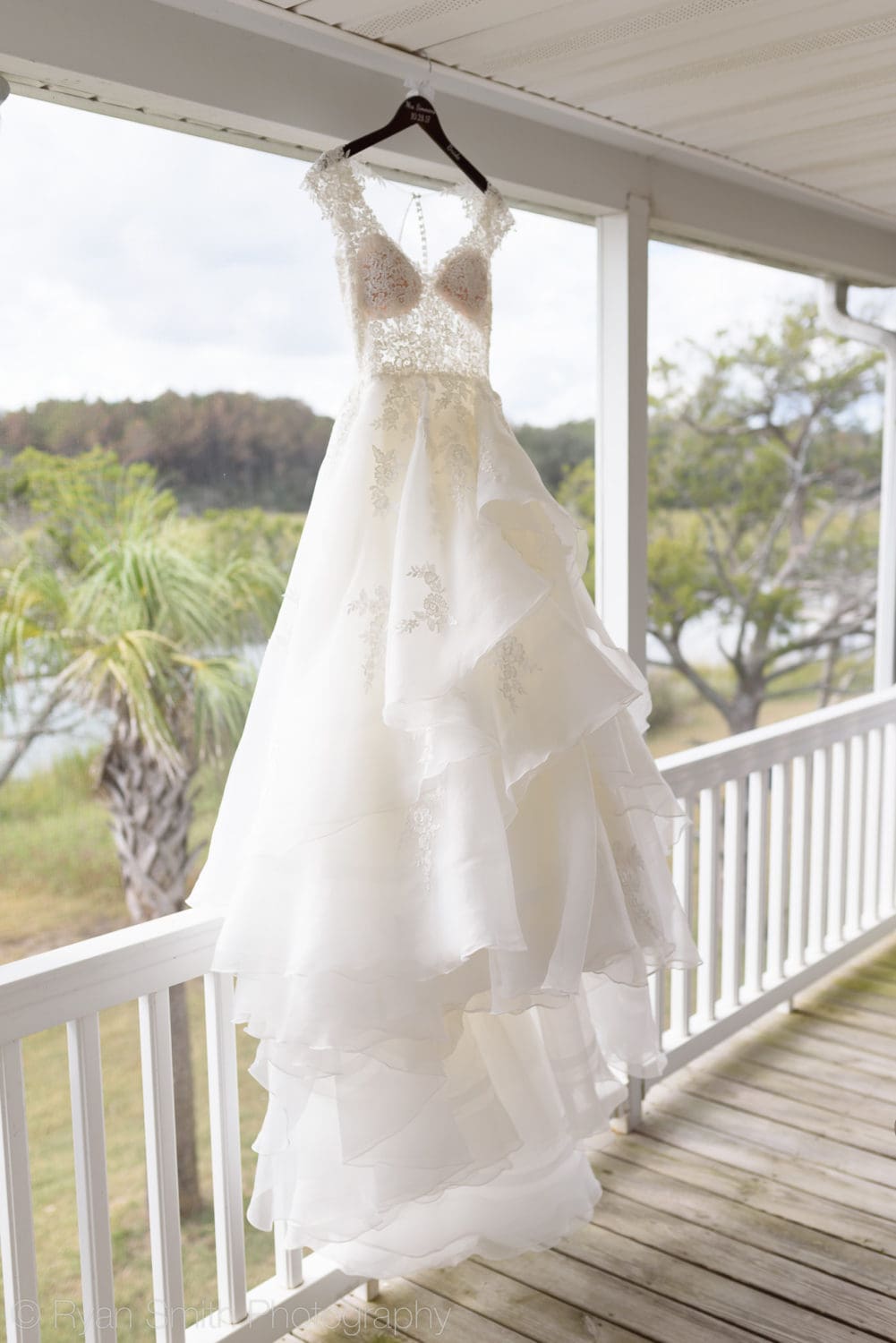 Brides dress hanging on the porch - Pawleys Island