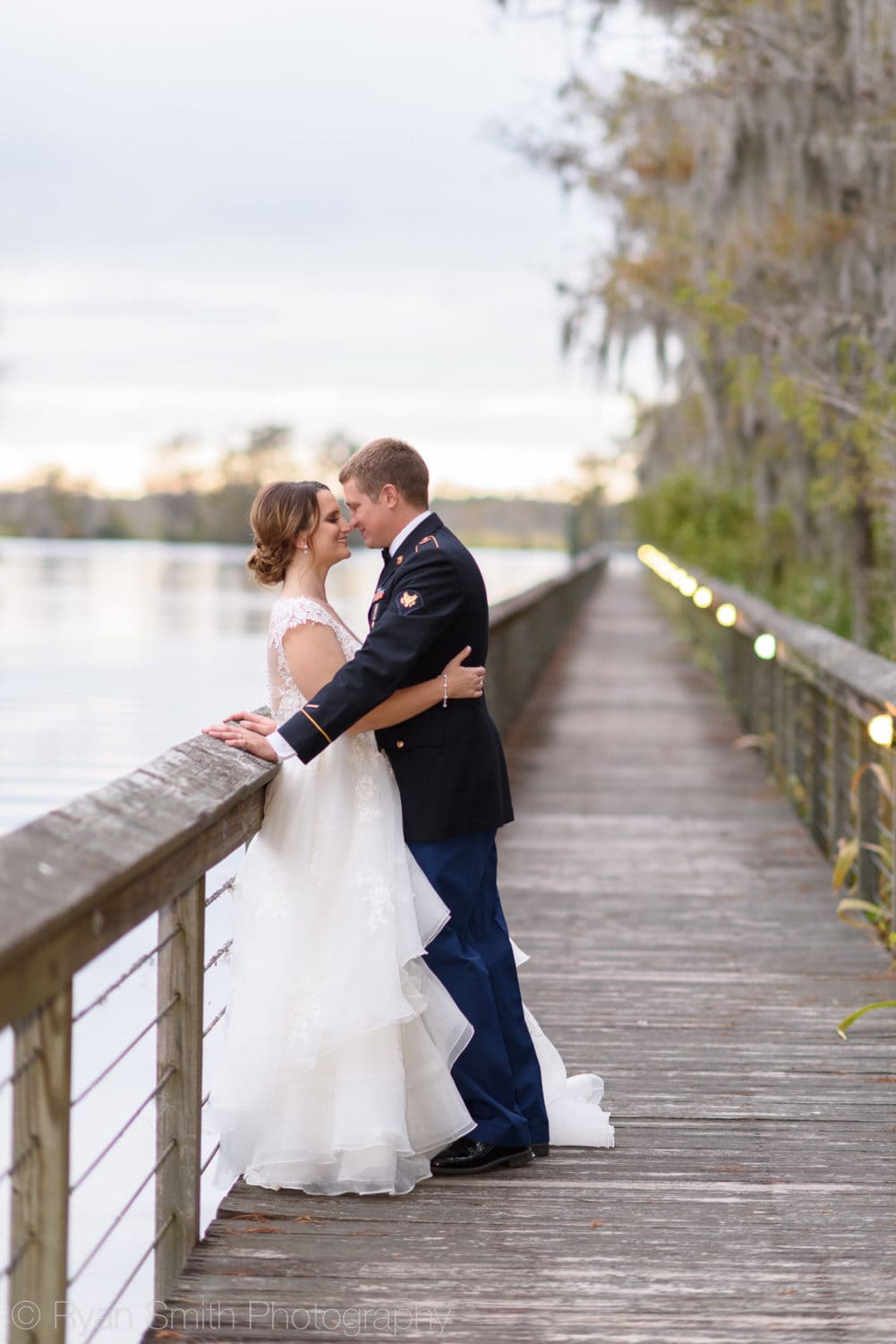 Couple leaning against the boardwalk railing - Reserve Harbor Yacht Club