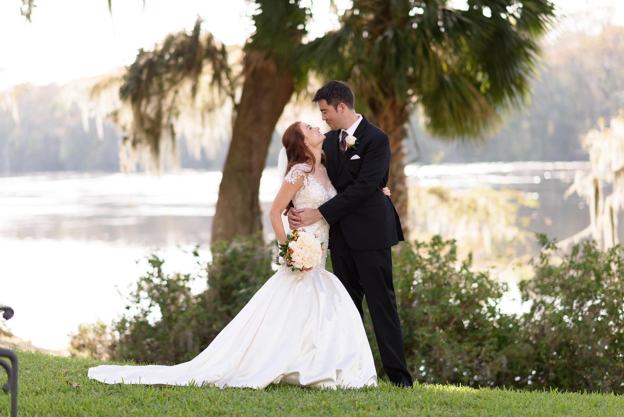Couple smiling at each other in by the river - Wachesaw Plantation