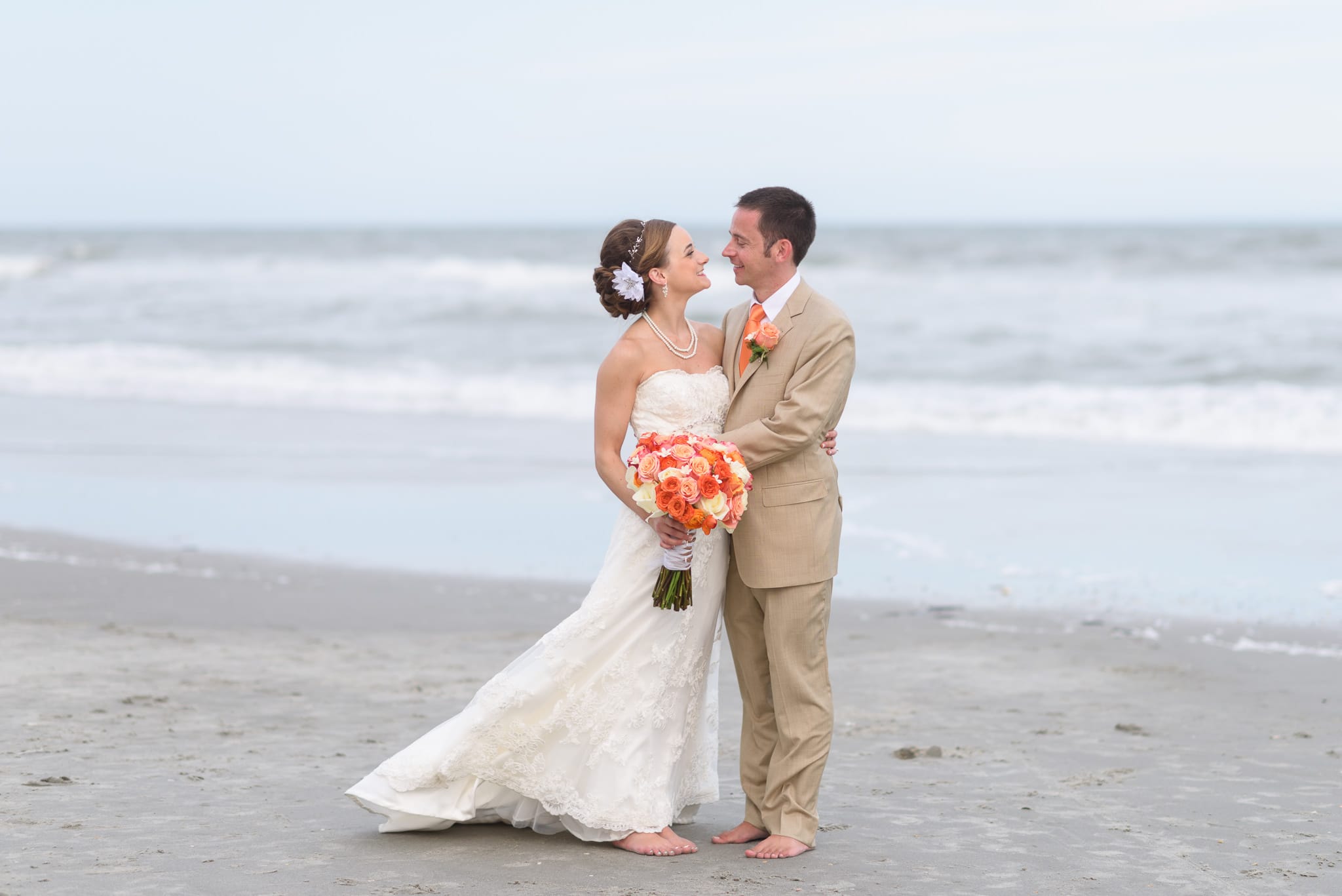 Couple smiling in front of the ocean - Hilton at Kingston Plantation