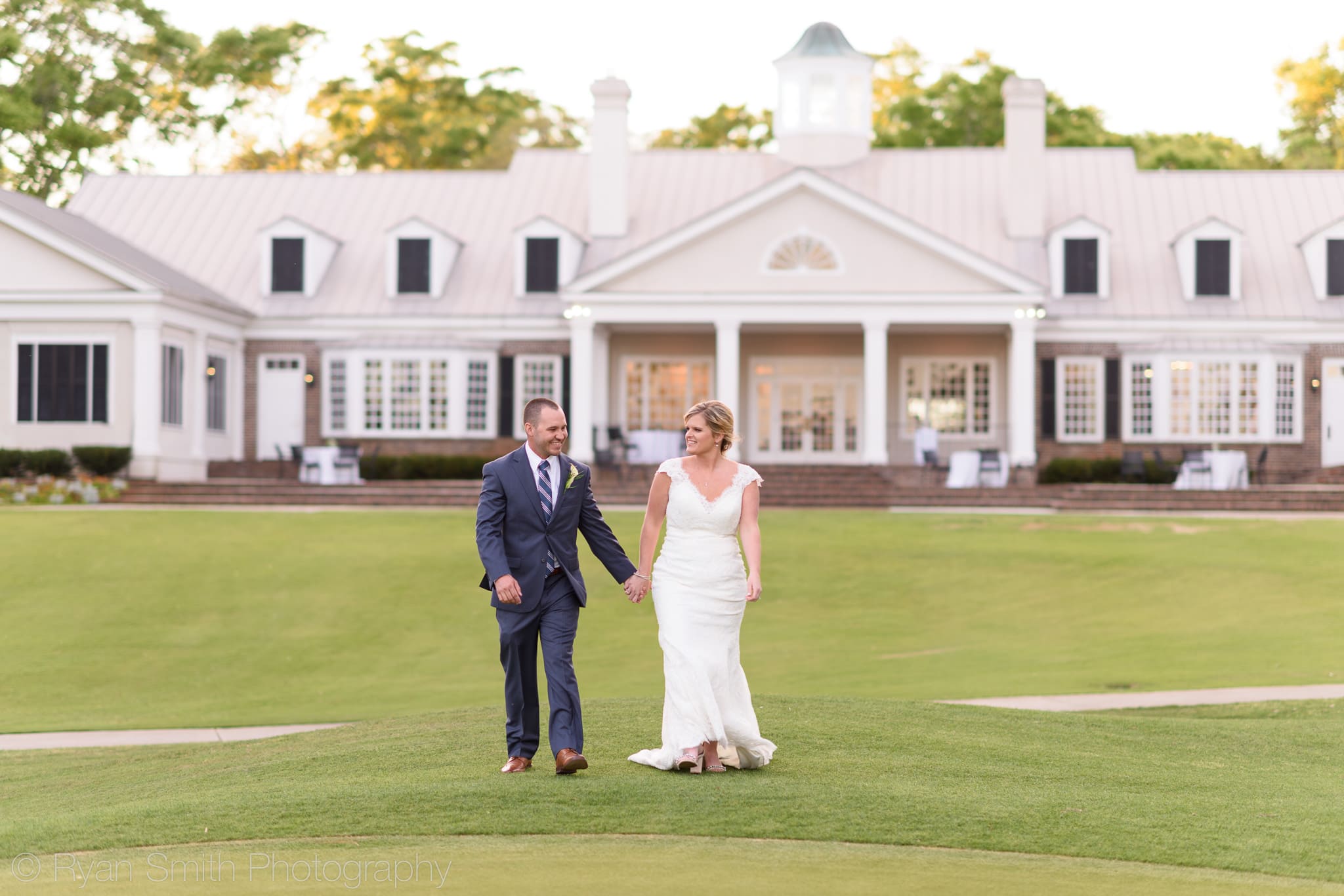 Couple walking away from the clubhouse - Pawleys Plantation