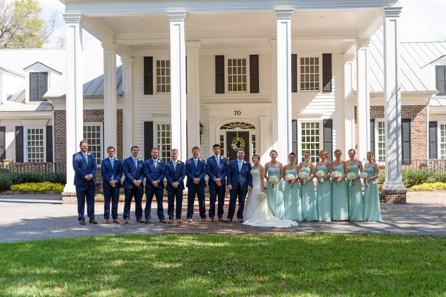 Entire wedding party in front of columns - Pawleys Plantation