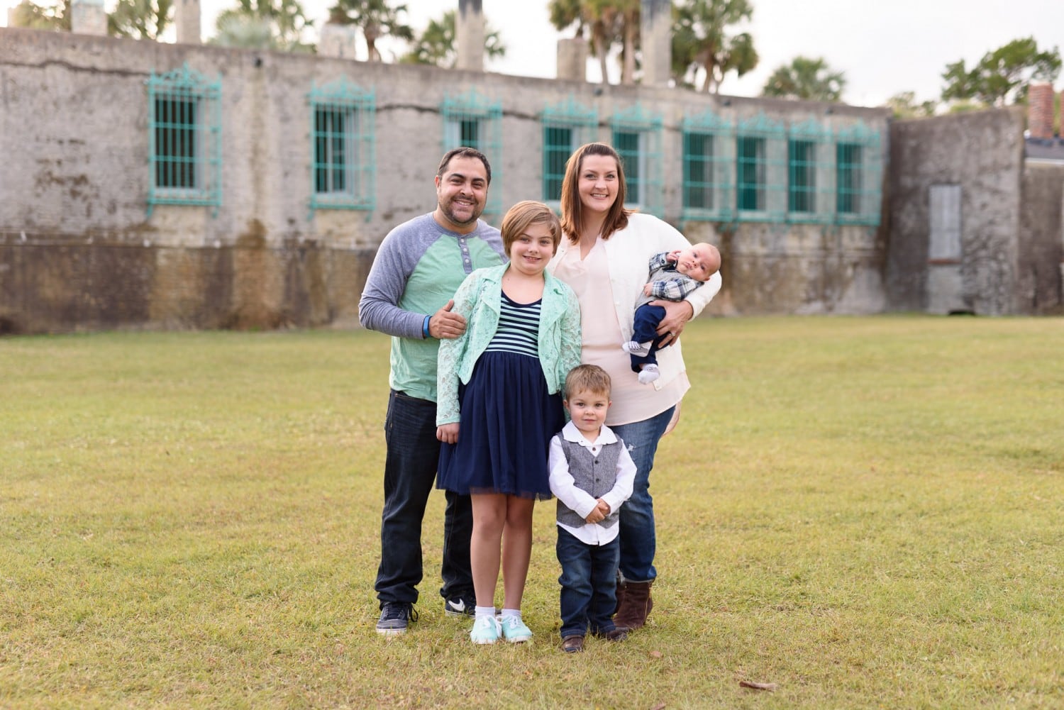 Family standing in front of the Atalaya Castle - Huntington State Park -