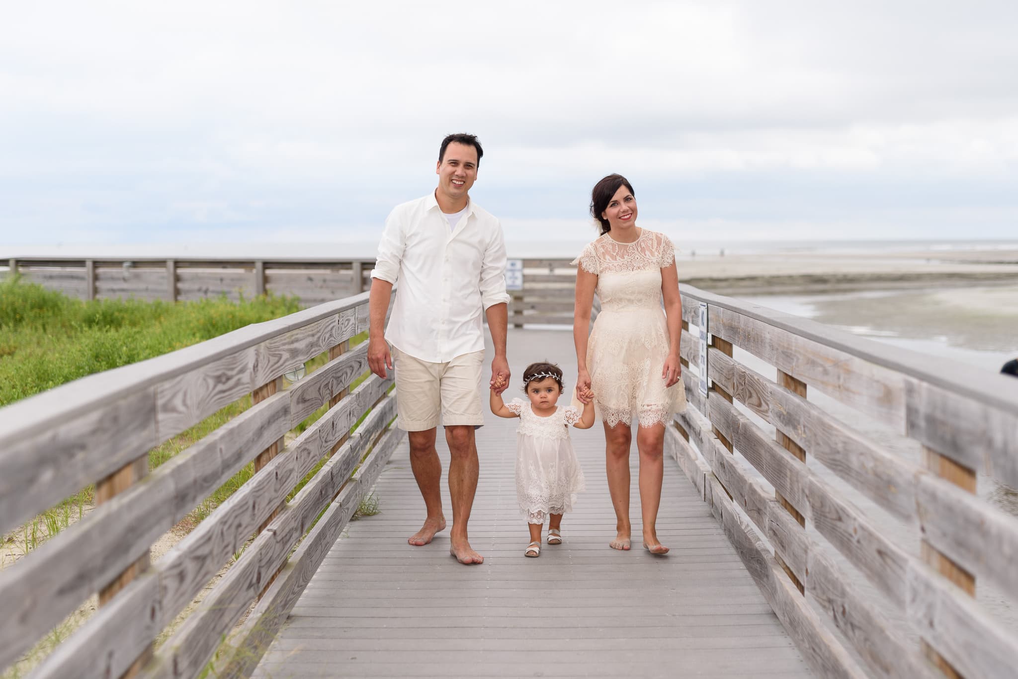 Family walking down boardwalk - North Beach Plantation