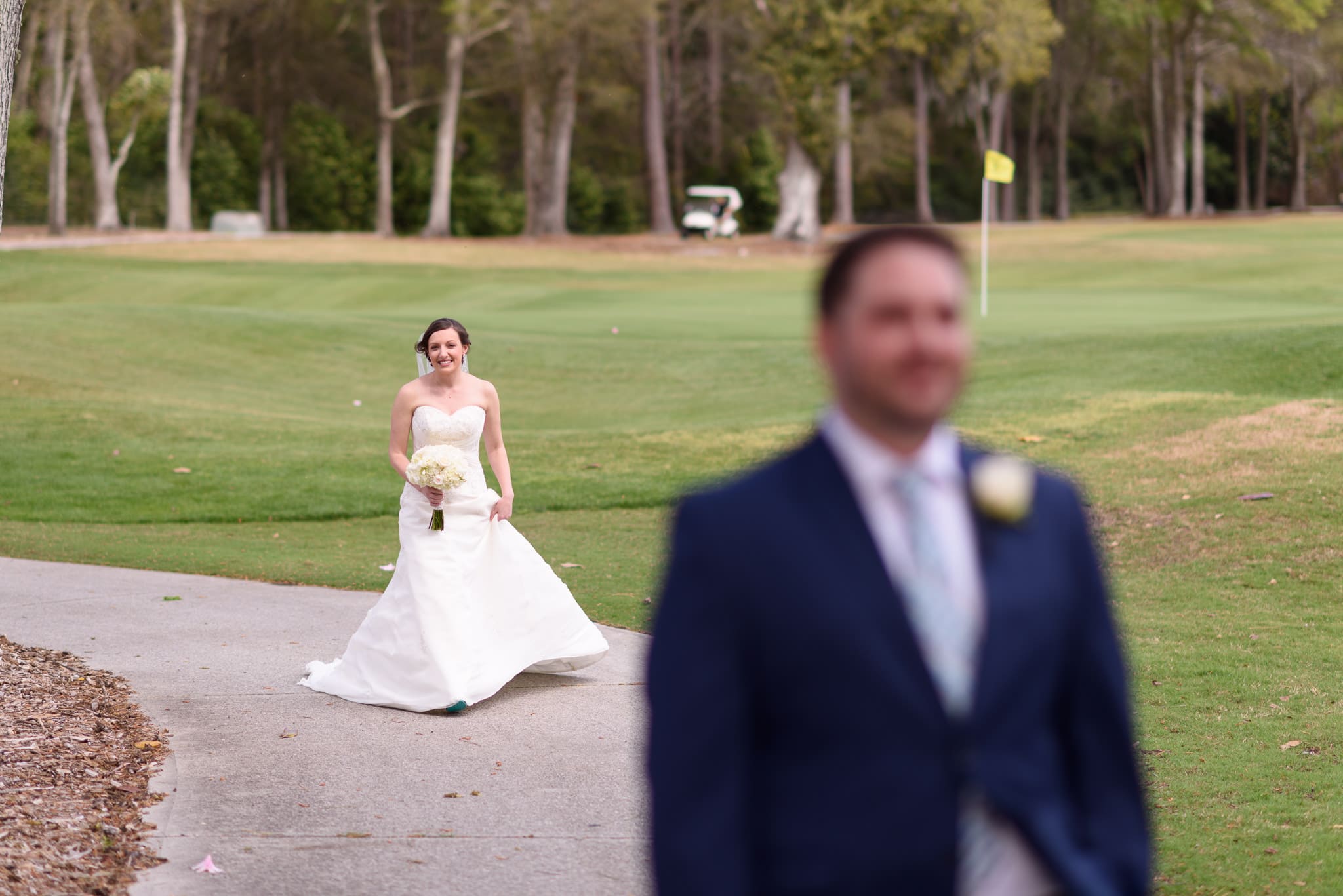 First look with bride and groom on golfcourse - Pawleys Plantation