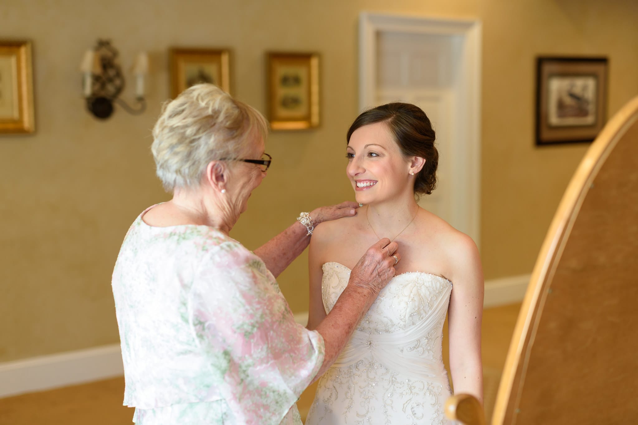 Grandmother helping bride get ready for wedding - Pawleys Plantation