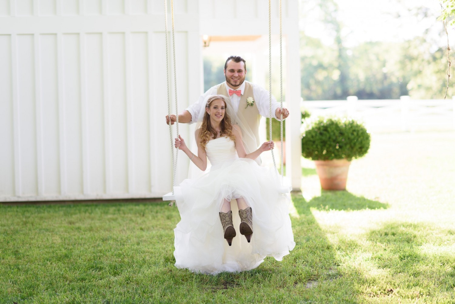 Groom pushing bride in a swing - Wildberry Farm