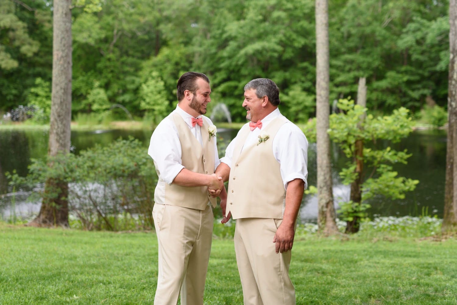 Groom shaking hand of father - Wildberry Farm