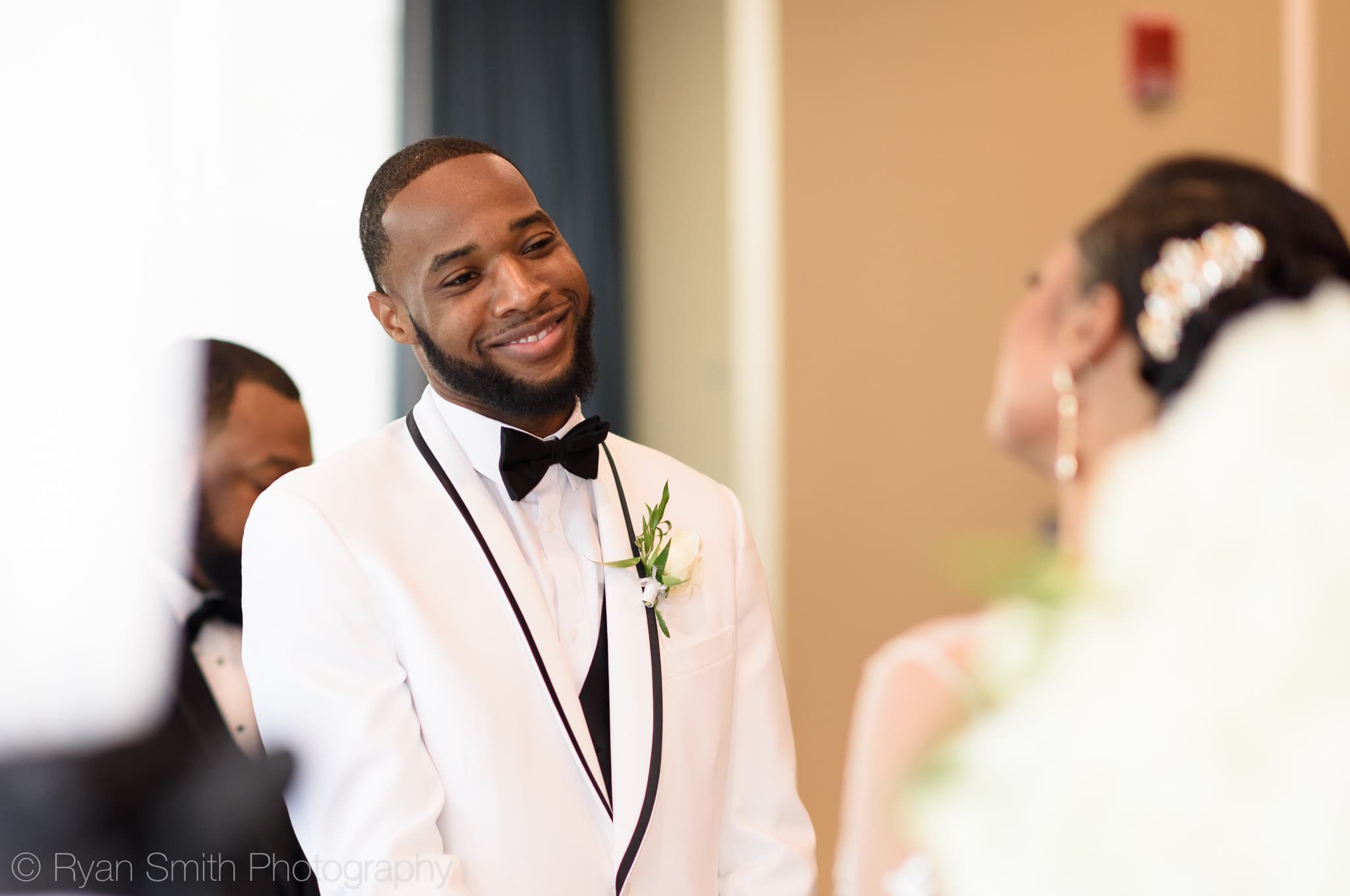 Groom smiling at bride during vows - Doubletree Resort by Hilton Myrtle Beach
