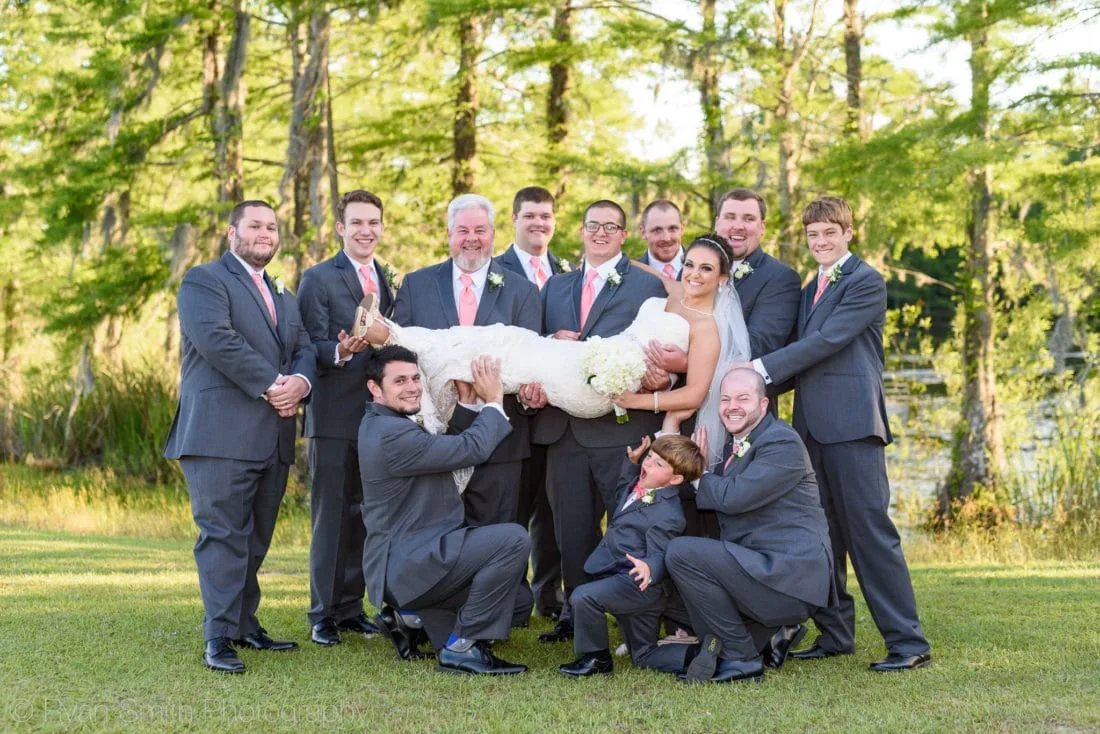 Groomsmen lifting up the bride - Upper Mill Plantation